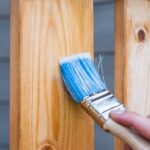 Person holding paint brush