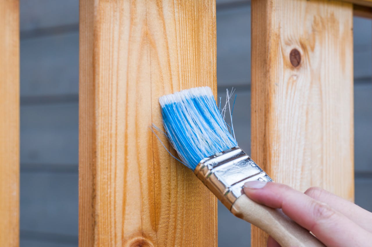 Person holding paint brush